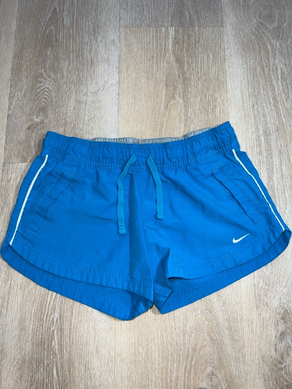 Vintage Nike Women's Bright Blue Athletic Shorts with White Trim